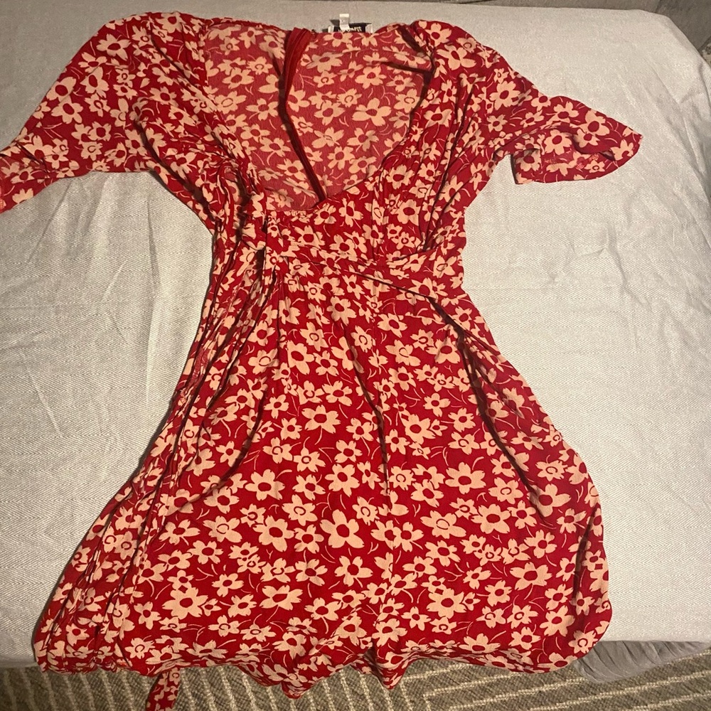 Madewell wrap-front romper in red with a mini daisy print